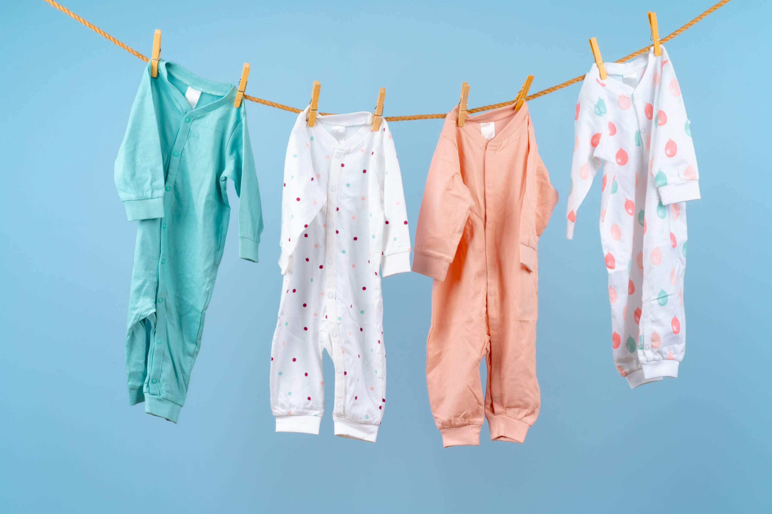 Cute toddler colorful clothing hang on a rope